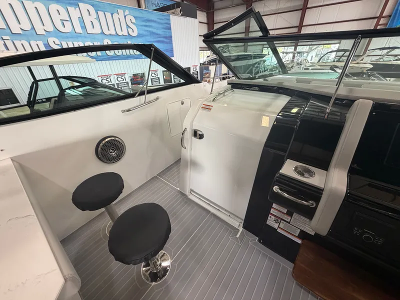 Slide: The Image of Interior of a 2027 Cruisers Yachts 38 GLS with two bar stools and modern features. - 4