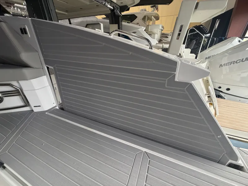 Slide: The Image of The 2027 Cruisers Yachts 38 GLS features a modern, gray deck surface with clean lines. - 12