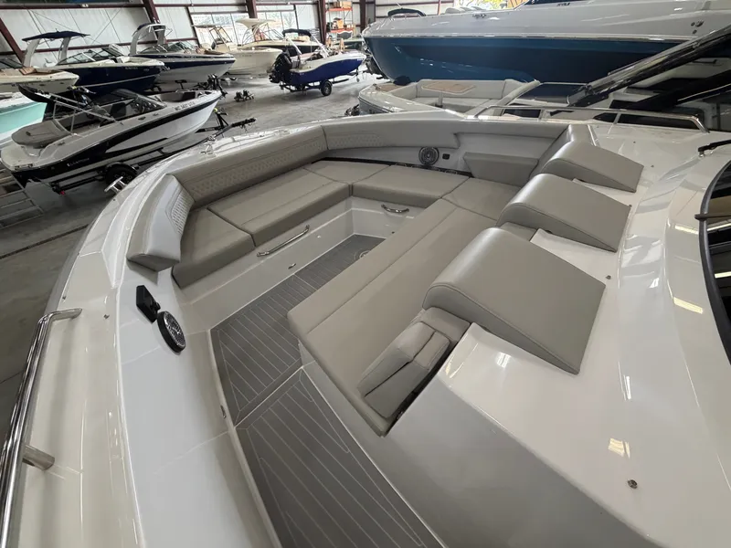 Slide: The Image of The image shows the spacious cockpit of a Cruisers Yachts 38 GLS with sleek seating. - 3