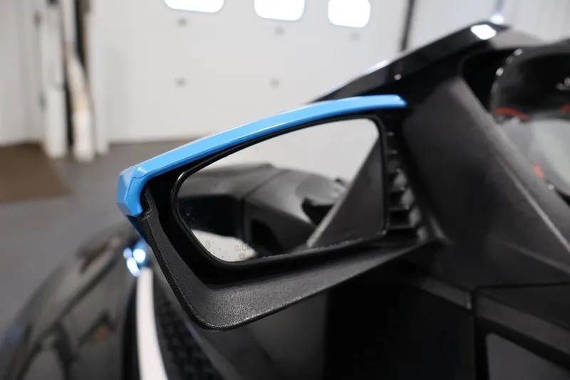 Slide: The Image of Close-up of a 2017 Sea-Doo RXT 260 side mirror with blue trim. - 6