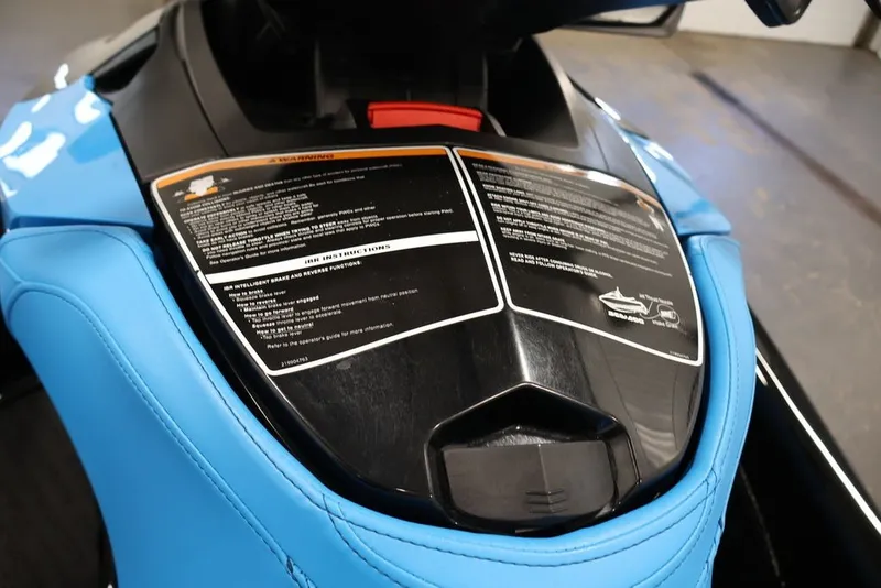 Slide: The Image of 2017 Sea-Doo RXT 260 jet ski with blue seat and safety instructions. - 7