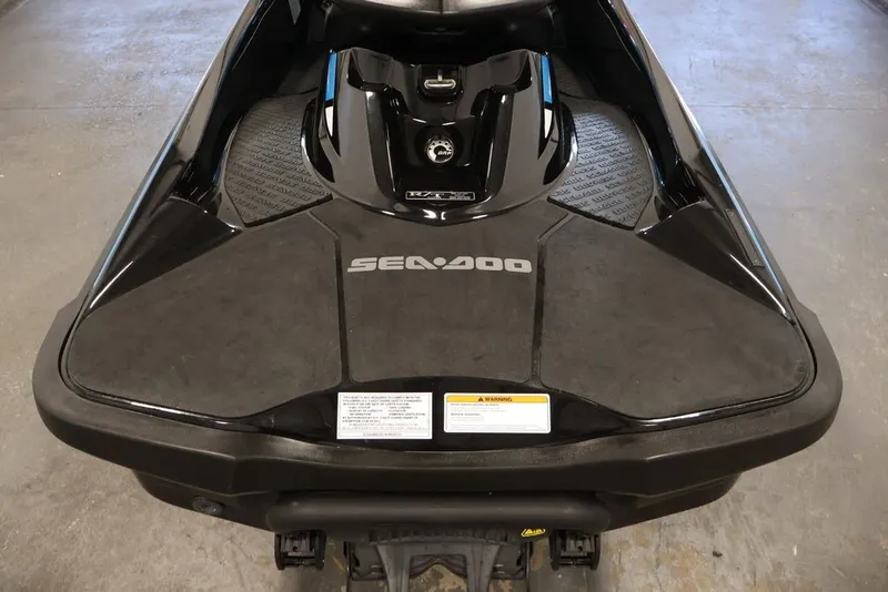 Slide: The Image of 2017 Sea-Doo RXT 260 jet ski, black, top view in a garage setting. - 16