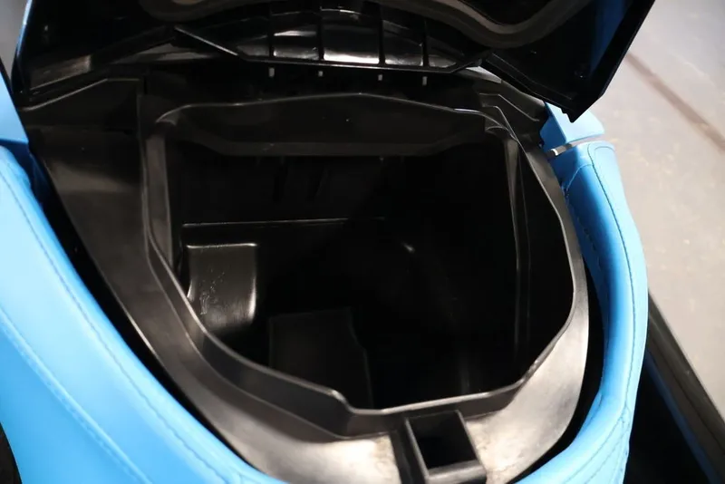 Slide: The Image of Open storage compartment of 2017 Sea-Doo RXT 260 with blue trim. - 5