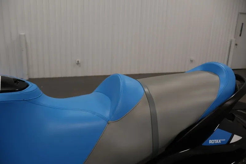 Slide: The Image of 2017 Sea-Doo RXT 260 jet ski seat, blue and gray design, indoor setting. - 10