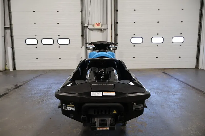 Slide: The Image of 2017 Sea-Doo RXT 260 jet ski in a garage, rear view. - 14