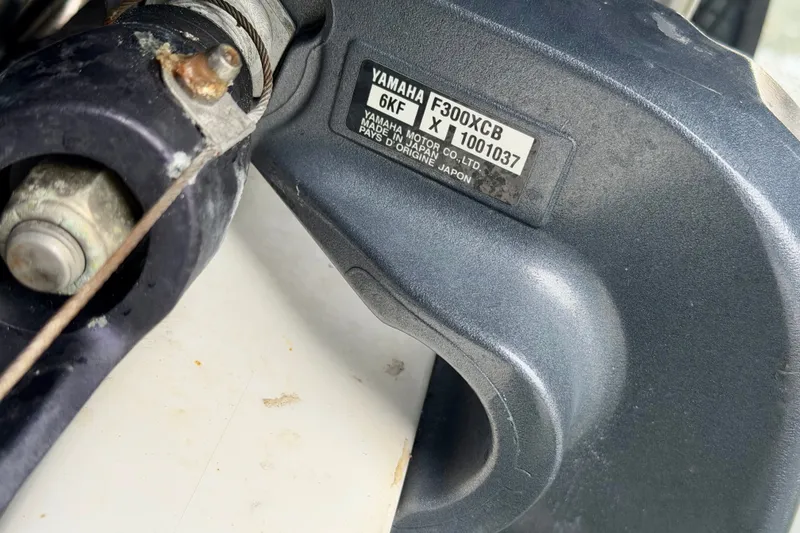Slide: The Image of Close-up of Yamaha F300XCB engine part on a 2007 Intrepid 327 Cuddy boat. - 21