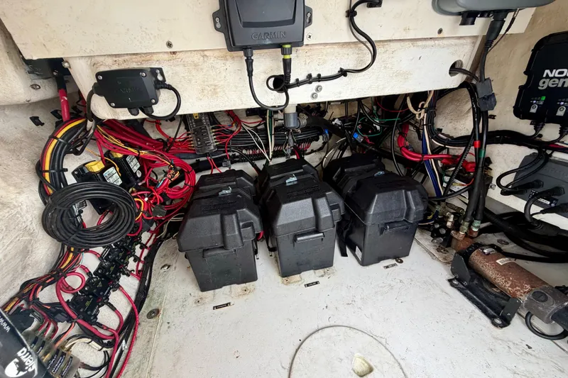 Slide: The Image of Electrical system of a 2007 Intrepid 327 Cuddy boat with battery boxes and wiring. - 22