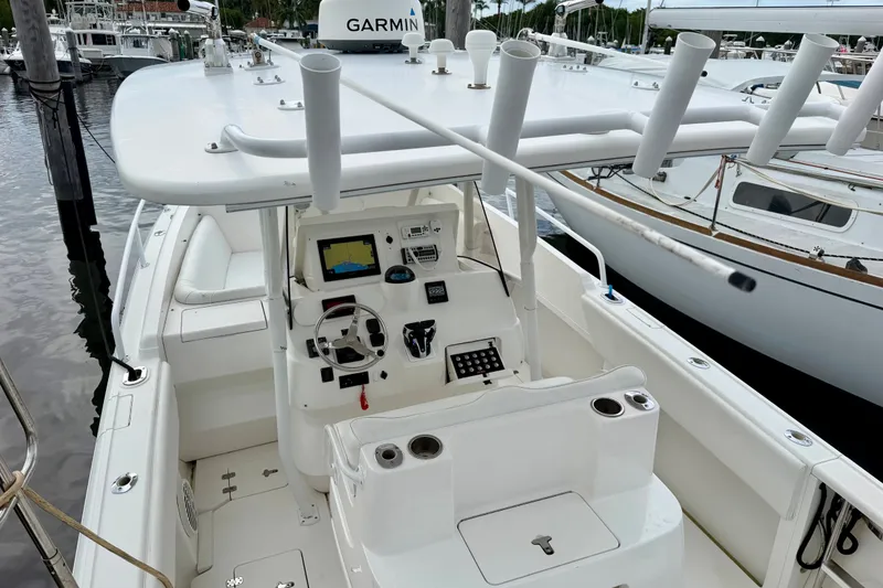 Slide: The Image of 2007 Intrepid 327 Cuddy boat cockpit with Garmin navigation system, docked at marina. - 6