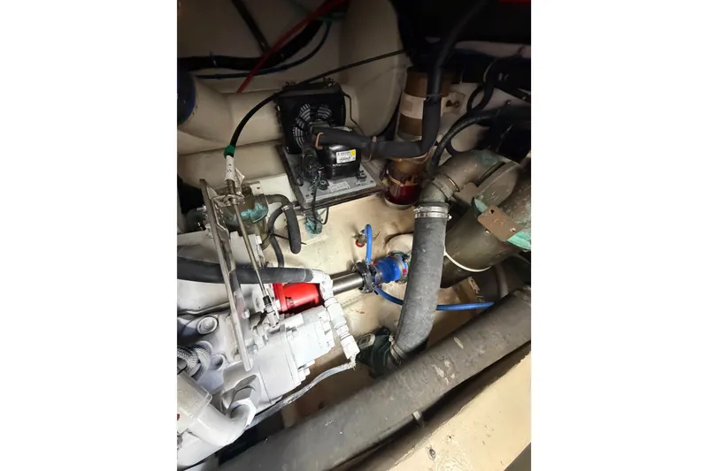 Slide: The Image of Engine compartment of a 2000 Tiara Yachts 4300 Convertible, showcasing mechanical components and wiring. - 40