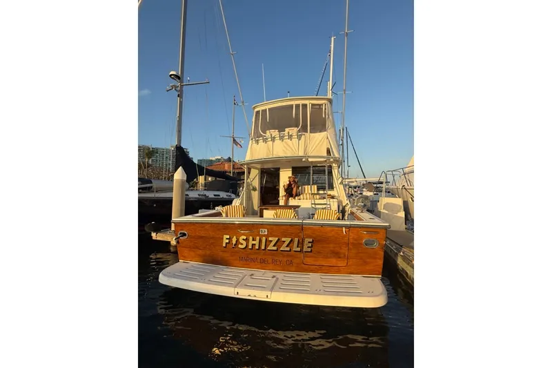 Slide: The Image of 2000 Tiara Yachts 4300 Convertible docked, rear view, named "Fishizzle," Marina del Rey, CA. - 5