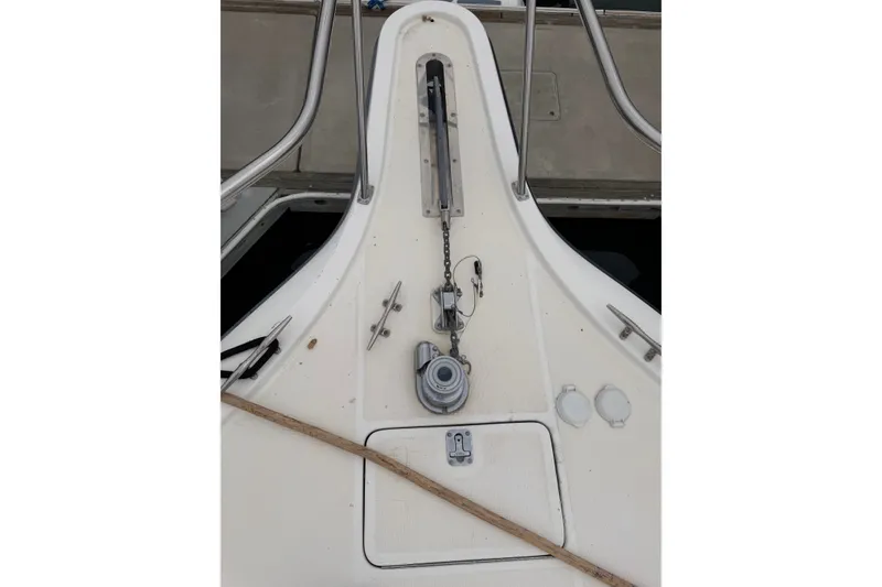 Slide: The Image of Bow of 2000 Tiara Yachts 4300 Convertible with anchor chain and cleats. - 6