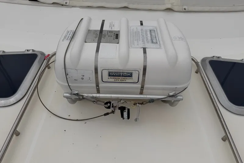 Slide: The Image of Life raft on 2000 Tiara Yachts 4300 Convertible deck, secured with metal straps. - 9