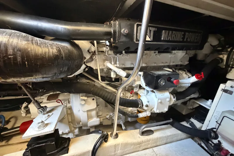 Slide: The Image of Engine room of a 2000 Tiara Yachts 4300 Convertible, featuring marine power components. - 41