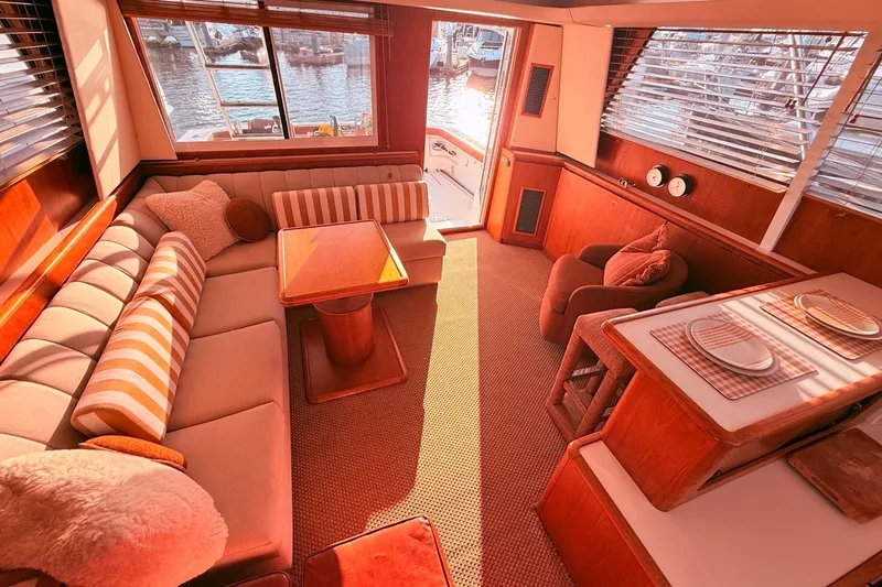 Slide: The Image of Luxurious interior of a 2000 Tiara Yachts 4300 Convertible with elegant seating and dining area. - 19