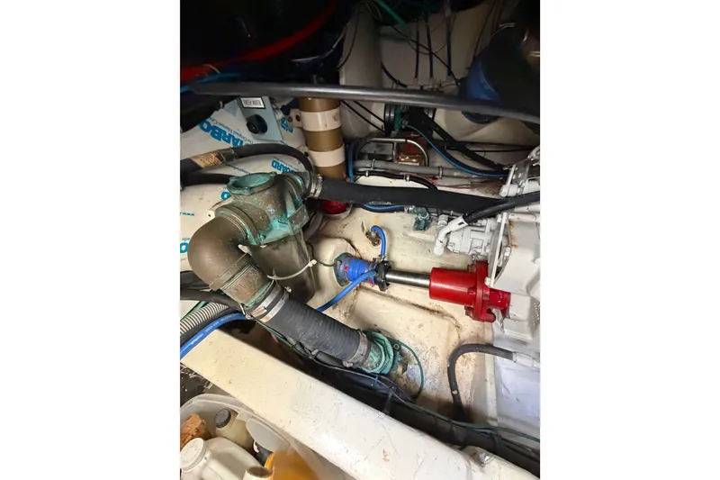 Slide: The Image of Engine room of 2000 Tiara Yachts 4300 Convertible, showcasing mechanical components and piping. - 39