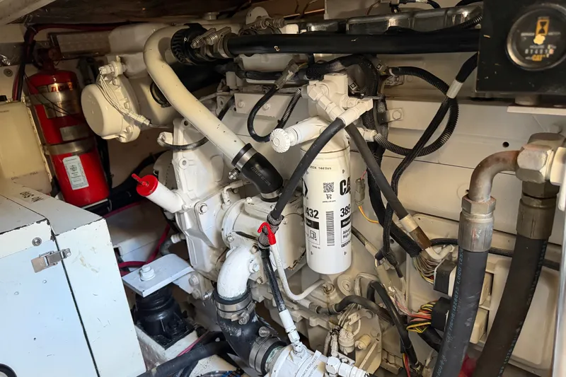 Slide: The Image of Engine room of a 2000 Tiara Yachts 4300 Convertible, showcasing mechanical components and wiring. - 42