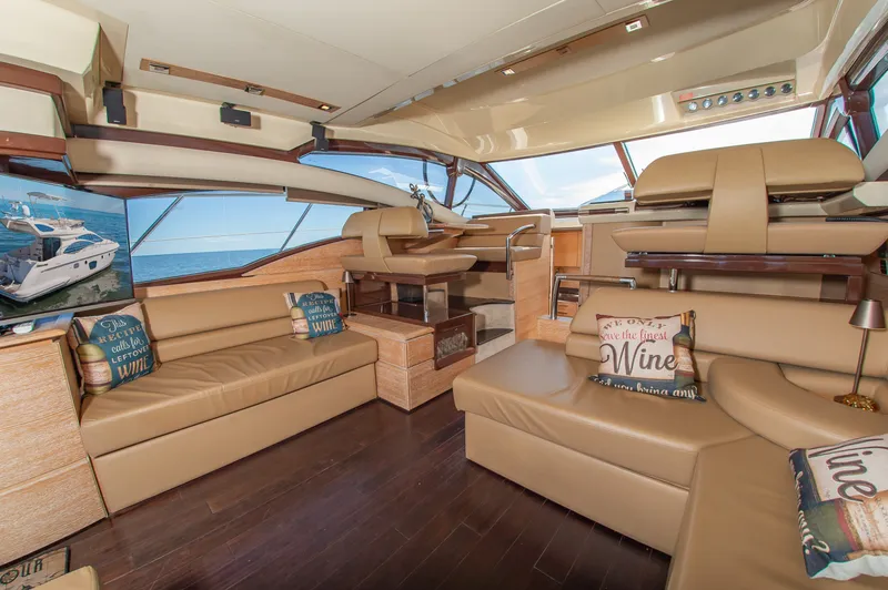 Slide: The Image of Interior of a 2008 Azimut 47 with leather sofas and large windows. - 17