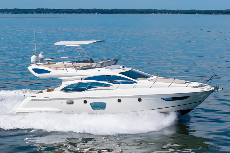 Slide: The Image of A sleek 2008 Azimut 47 yacht cruising swiftly over calm waters. - 41
