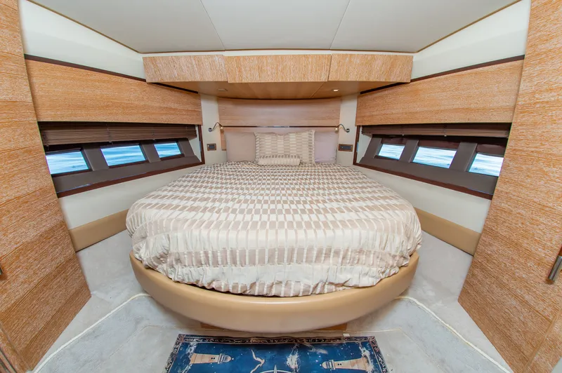 Slide: The Image of Luxurious cabin with a round bed and large windows on a 2008 Azimut 47 yacht. - 26