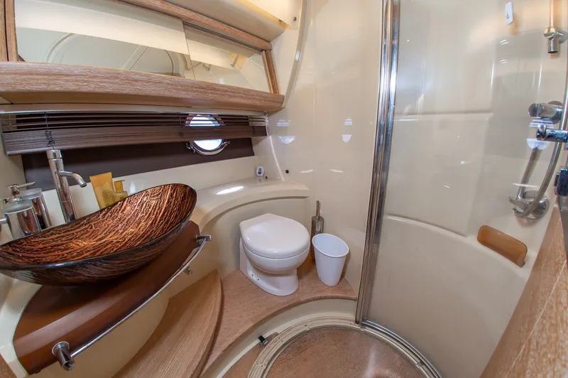 Slide: The Image of Luxurious bathroom with modern sink, toilet, and shower in a 2008 Azimut 47 yacht. - 29
