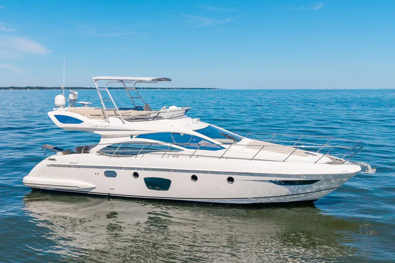Slide: The Image of 2008 Azimut 47 on calm water with a clear sky. - 6