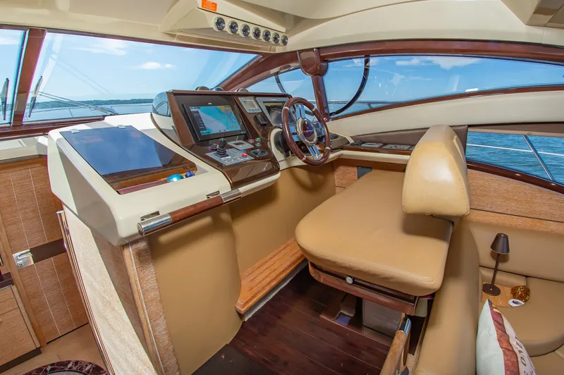 Slide: The Image of The image shows the cockpit of a 2008 Azimut 47 with modern navigation systems. - 22