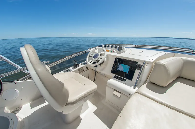 Slide: The Image of The image shows the cockpit of a 2008 Azimut 47 with a helm and navigation screen. - 16