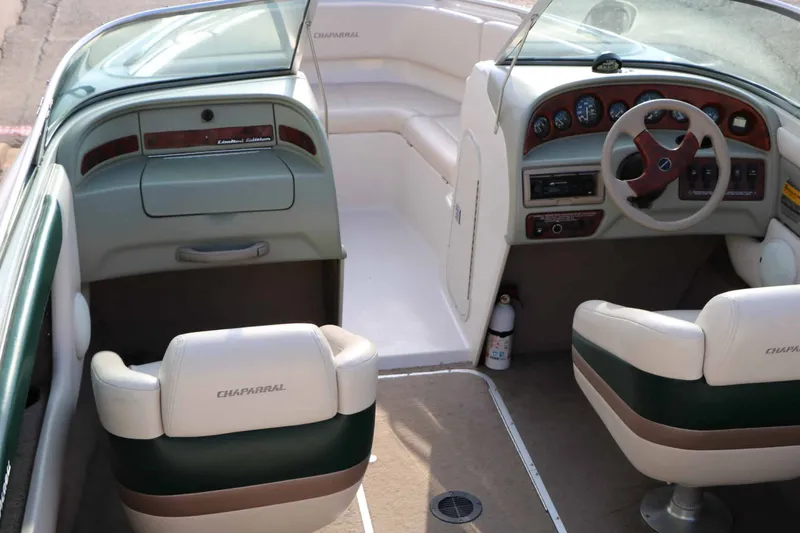 Slide: The Image of The image shows the cockpit of a 1997 Chaparral 2130 Sport Limited with two seats and a steering wheel. - 14