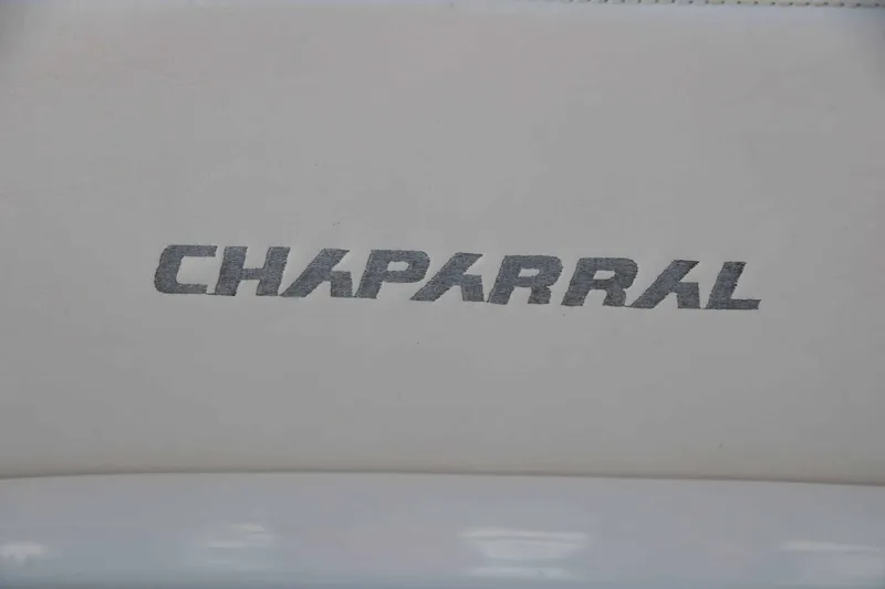 Slide: The Image of Close-up of the Chaparral logo on a white cushion. - 22