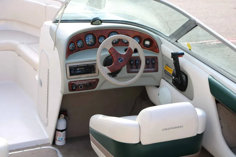 Slide: The Image of The image shows the cockpit of a 1997 Chaparral 2130 Sport Limited with a sleek dashboard. - 12