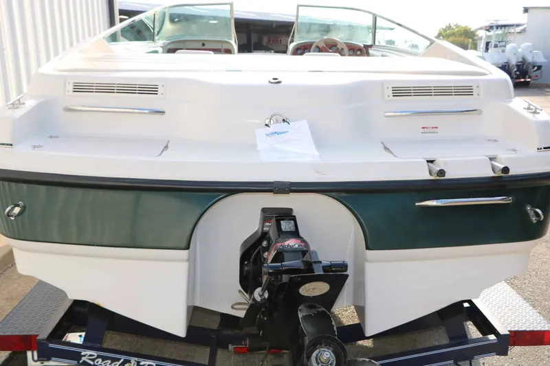 Slide: The Image of The image shows the rear of a 1997 Chaparral 2130 Sport Limited on a trailer. - 7
