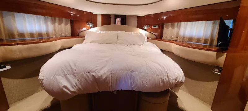 Slide: The Image of Luxurious bedroom with a large bed, surrounded by wood paneling and curtains. - 3