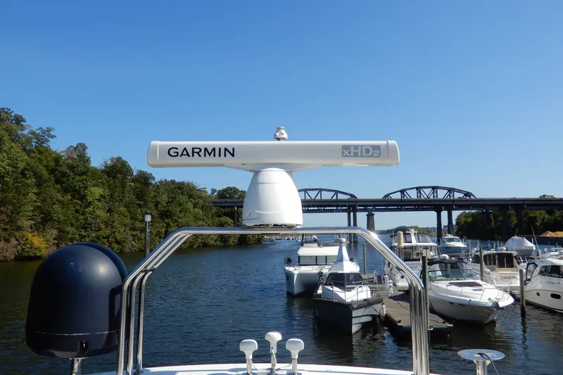 Slide: The Image of 2008 Viking Sport Cruisers 61 Motor Yacht with Garmin radar on a sunny day at the marina. - 34