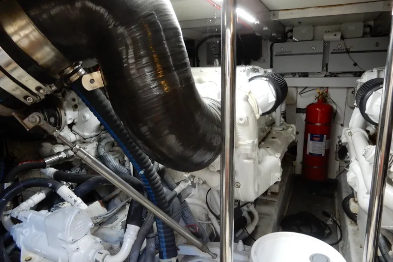 Slide: The Image of Engine room of 2008 Viking Sport Cruisers 61 Motor Yacht with visible machinery and fire extinguisher. - 125