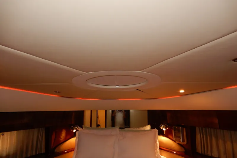 Slide: The Image of Luxurious interior of 2008 Viking Sport Cruisers 61 Motor Yacht cabin with ambient lighting. - 105