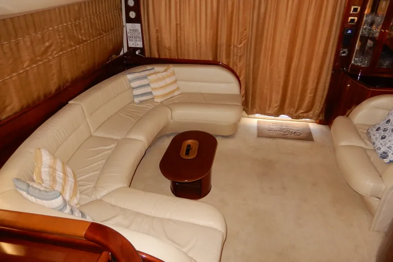 Slide: The Image of Luxurious interior of 2008 Viking Sport Cruisers 61 Motor Yacht with plush seating and elegant decor. - 56