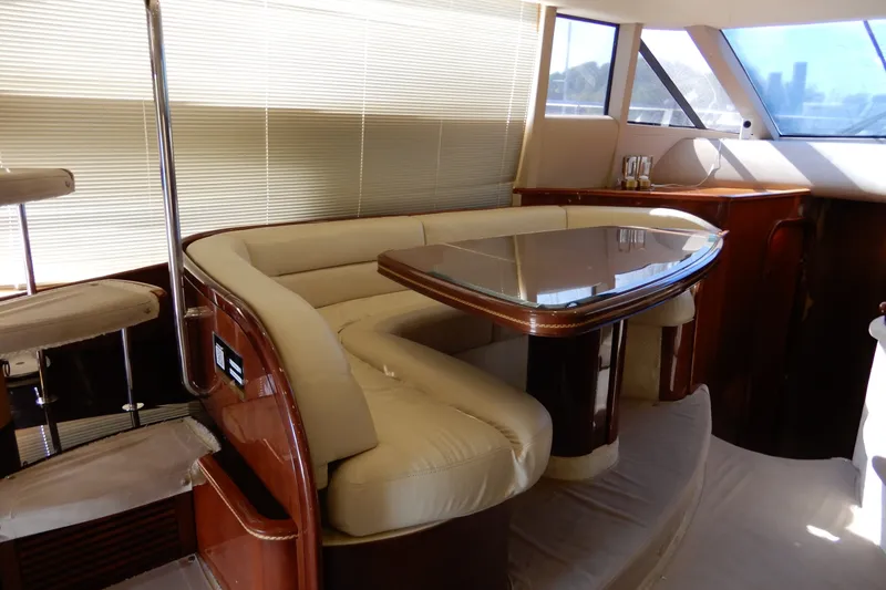 Slide: The Image of Luxurious interior of 2008 Viking Sport Cruisers 61 Motor Yacht with elegant seating and table. - 67