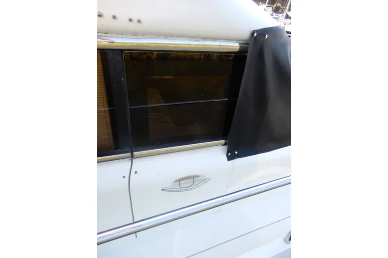 Slide: The Image of Close-up of 2008 Viking Sport Cruisers 61 Motor Yacht window and railing. - 16