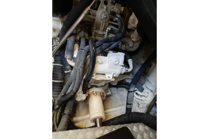 Slide: The Image of Engine compartment of a 2008 Viking Sport Cruisers 61 Motor Yacht, showing hoses and components. - 127