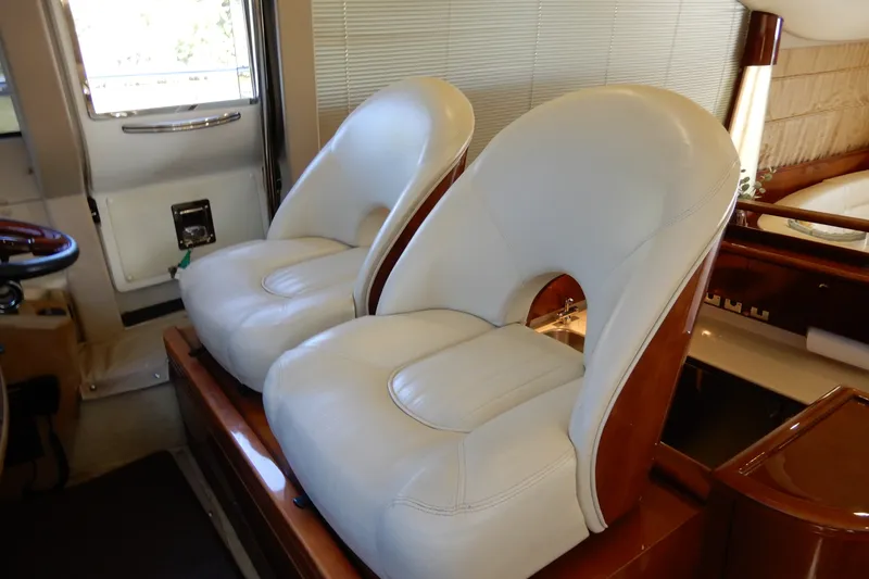 Slide: The Image of Luxurious white leather seats in 2008 Viking Sport Cruisers 61 Motor Yacht interior. - 81