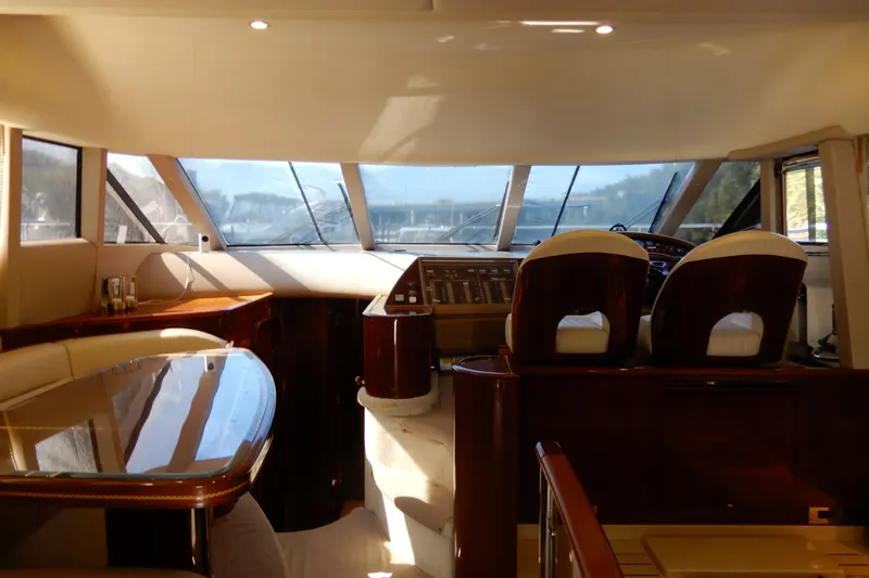 Slide: The Image of Luxurious interior of a 2008 Viking Sport Cruisers 61 Motor Yacht with elegant seating and helm. - 79