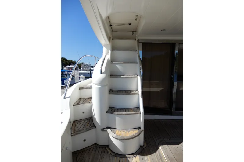 Slide: The Image of Staircase on 2008 Viking Sport Cruisers 61 Motor Yacht, leading to upper deck. - 26