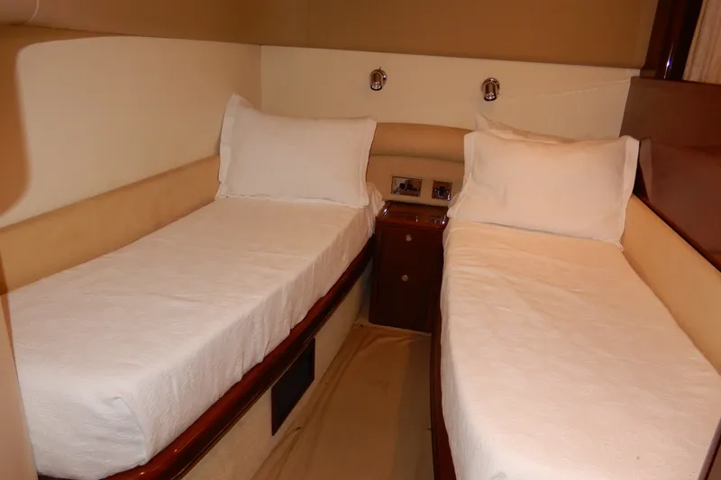Slide: The Image of Twin beds in a 2008 Viking Sport Cruisers 61 Motor Yacht cabin. - 91