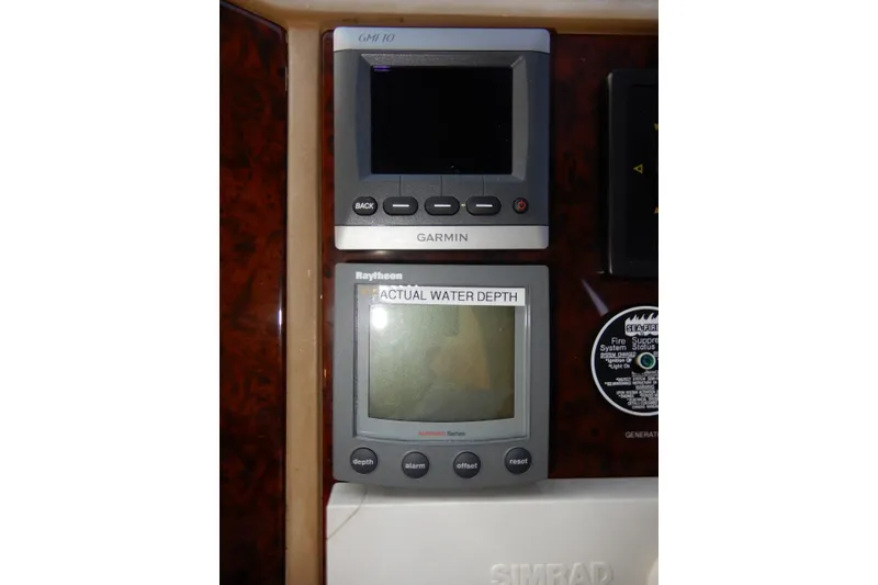 Slide: The Image of Garmin and Raytheon navigation displays on 2008 Viking Sport Cruisers 61 Motor Yacht. - 87