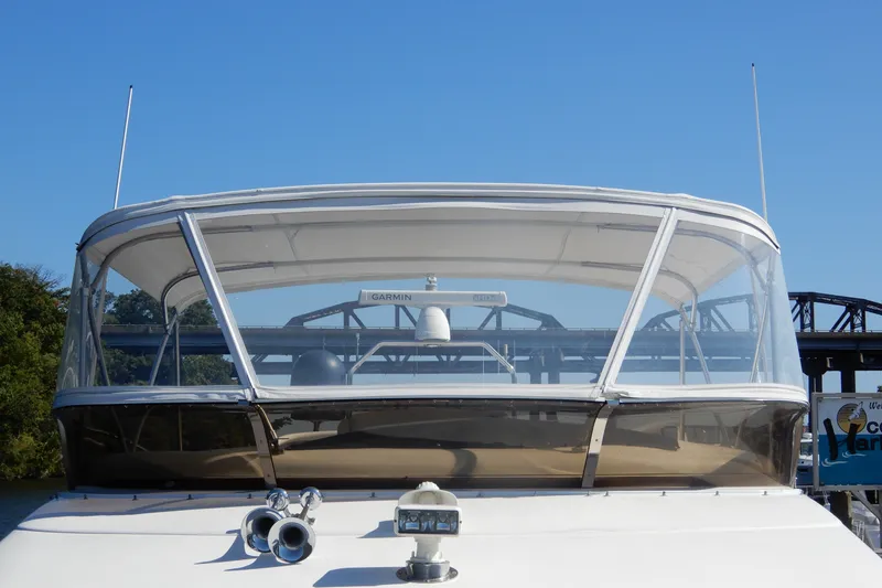 Slide: The Image of 2008 Viking Sport Cruisers 61 Motor Yacht with clear canopy and Garmin equipment. - 25