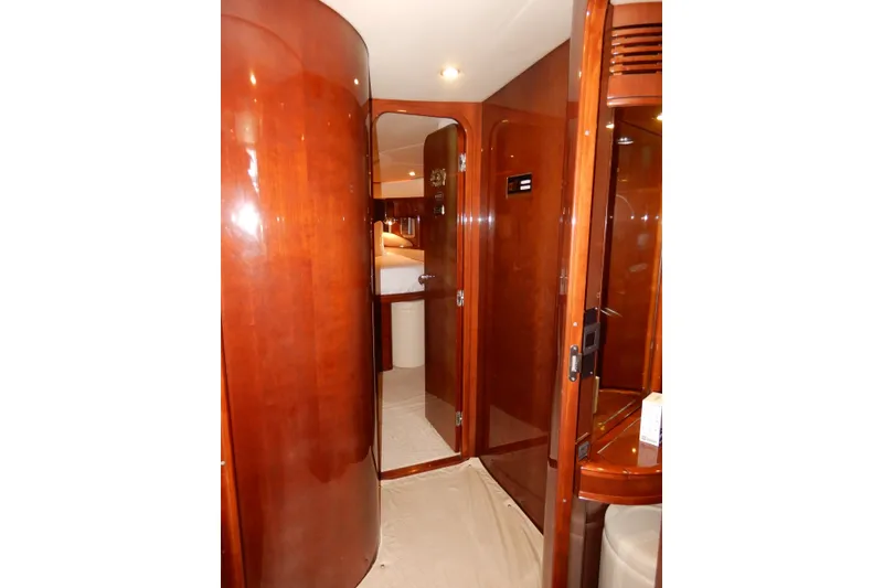 Slide: The Image of Luxurious wooden interior of a 2008 Viking Sport Cruisers 61 Motor Yacht cabin. - 99
