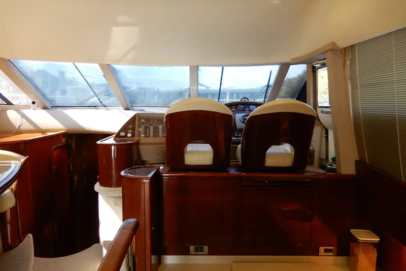 Slide: The Image of Luxurious interior of a 2008 Viking Sport Cruisers 61 Motor Yacht helm station. - 78