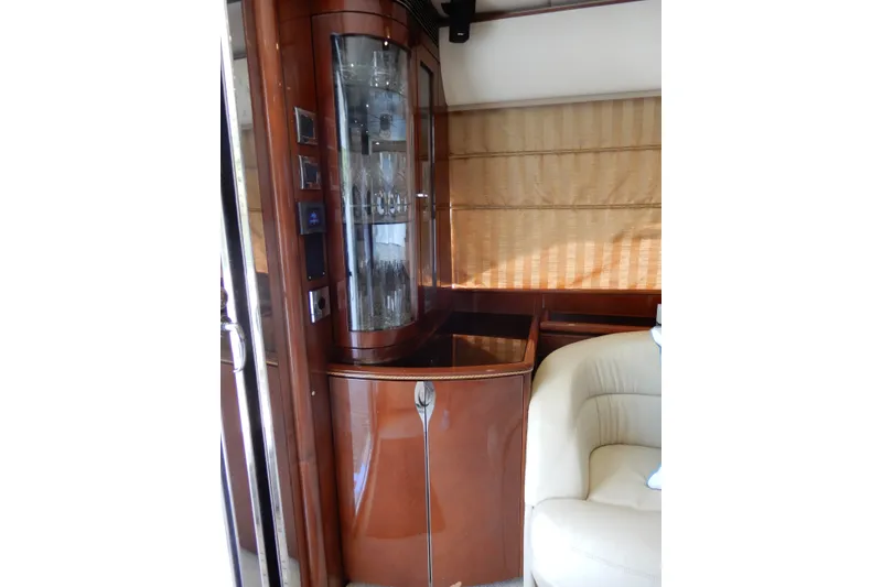 Slide: The Image of Luxurious interior of 2008 Viking Sport Cruisers 61 Motor Yacht with elegant wood cabinetry. - 60