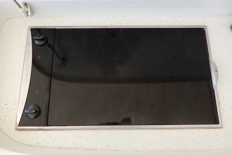 Slide: The Image of A built-in cooktop with two control knobs on a yacht. - 36