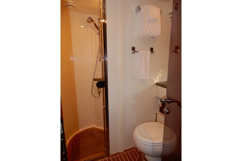 Slide: The Image of Bathroom interior of 2008 Viking Sport Cruisers 61 Motor Yacht, featuring shower and toilet. - 106